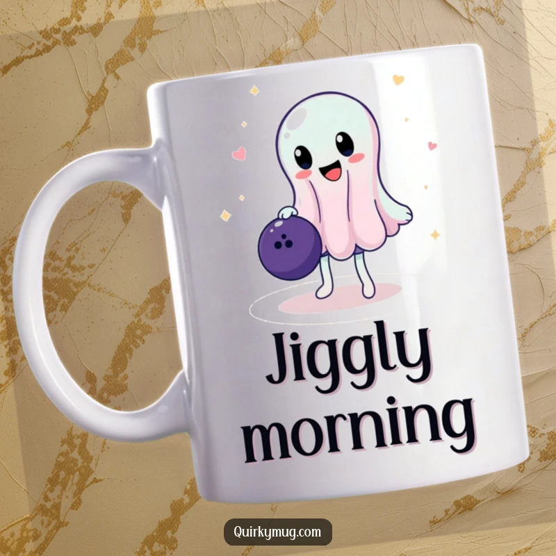 Funny mug with a jiggly, wobbly jelly character precariously balancing a large bowling ball, showing intense concentration and potential disaster.