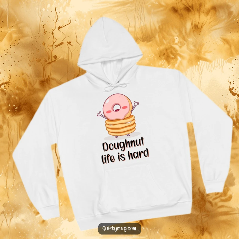 Funny hoodie depicting a wobbly jelly donut with small arms precariously balancing a large stack of pancakes, illustrating edible precariousness.