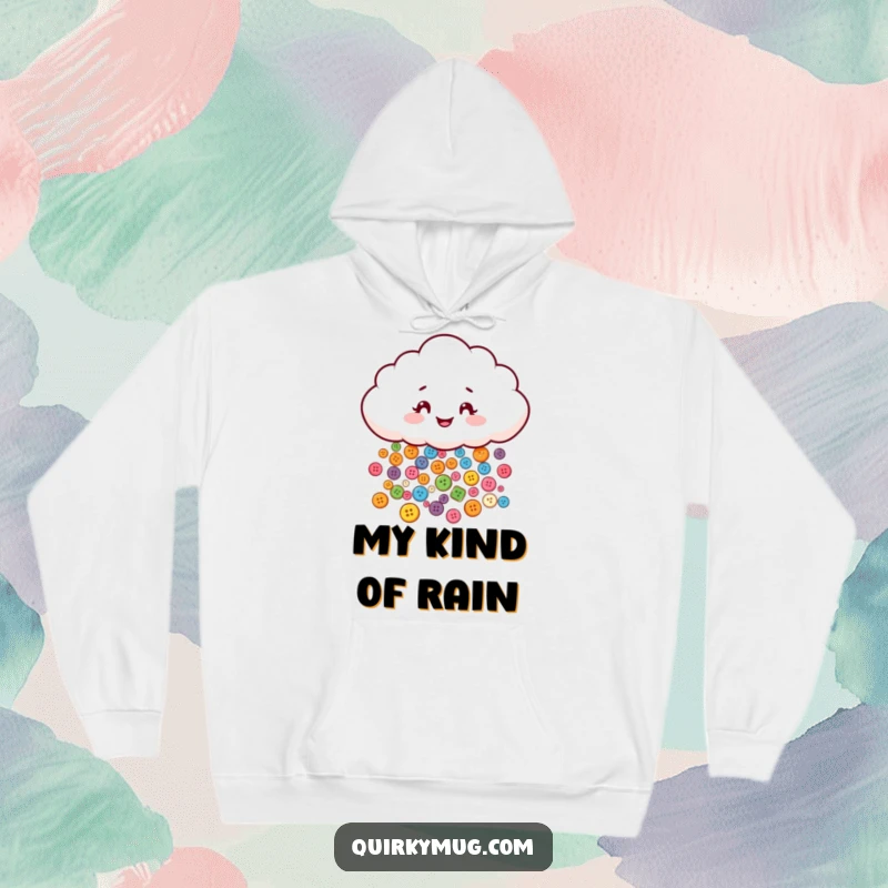 Funny hoodie with a mischievous cloud character distributing tiny, colorful buttons, offering warmth and whimsical charm.