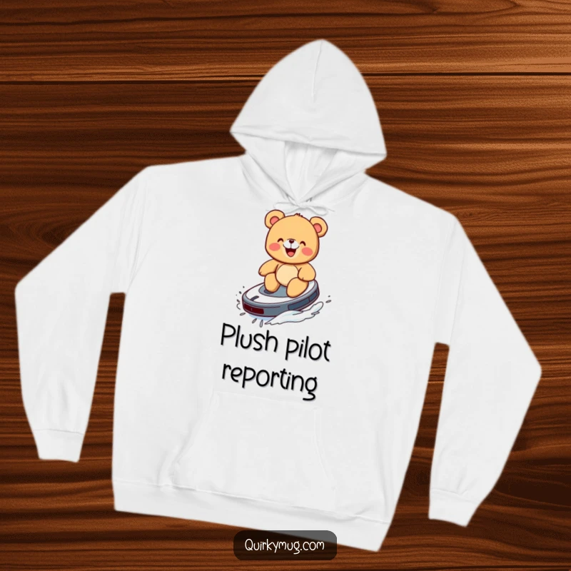 Funny hoodie featuring a giggling teddy bear attempting to surf on a Roomba like a surfboard.