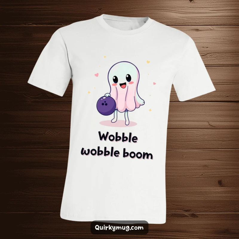 Funny t-shirt featuring a wobbly, translucent jelly character attempting to balance a heavy bowling ball, capturing a moment of intense, comical effort.