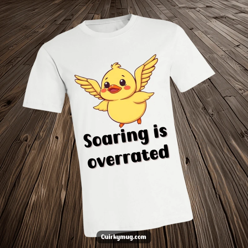 Funny Rubber Duck T-Shirt: A bewildered rubber duck tries to fly using only its wings, a hilarious and inspiring graphic tee.